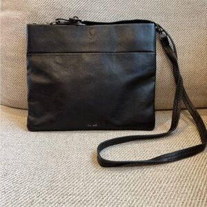The Sak Black Messenger Bag 100% leather zipper and magnetic closure